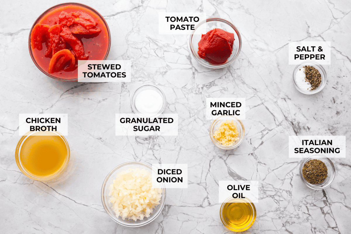 After re-testing this Homemade Marinara Sauce, I can confidently say itโs the BEST! You can make it in 15 minutes, but letting it simmer makes the flavors even better! Overhead shot of labeled ingredients.